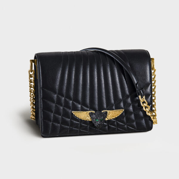 Black quilted leather handbag with gold chain and winged clasp.