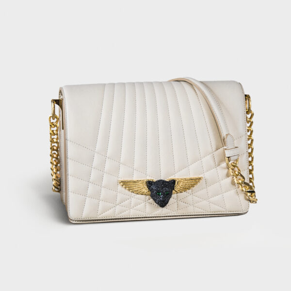 White quilted handbag with gold chain and winged emblem.