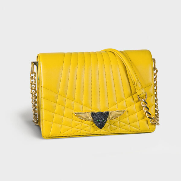 Yellow quilted leather handbag with a gold chain strap and heart-shaped clasp.