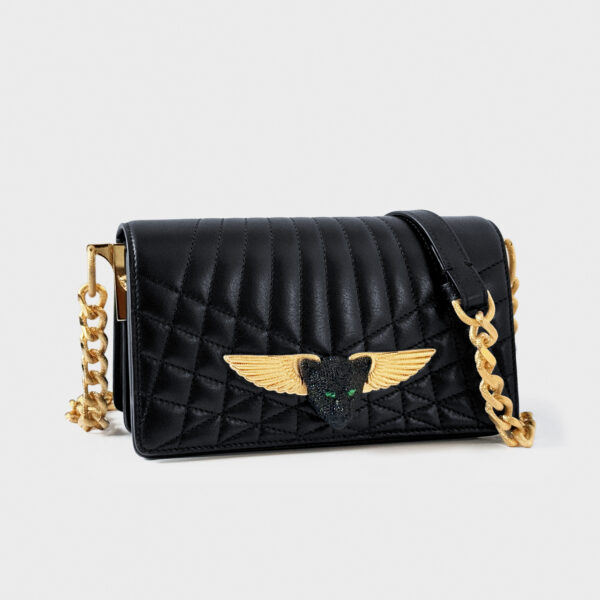 Black quilted handbag with gold winged emblem and chain strap.