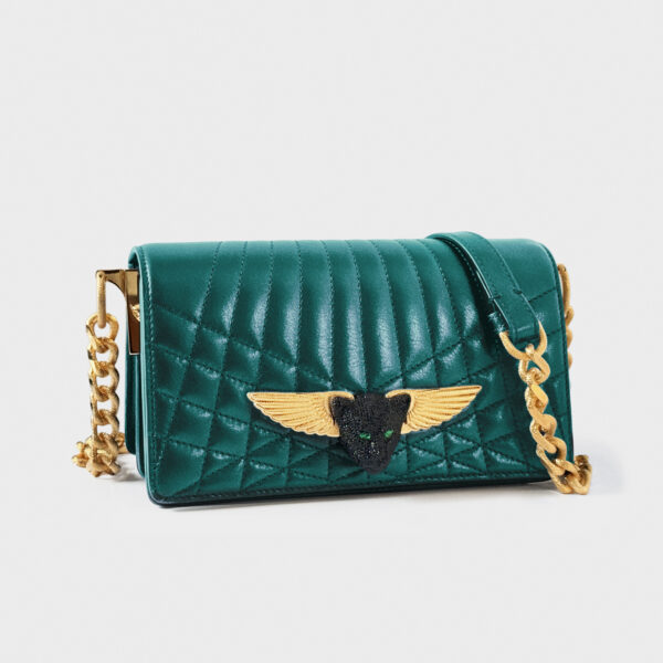 Elegant teal quilted handbag with gold winged emblem and chain strap.