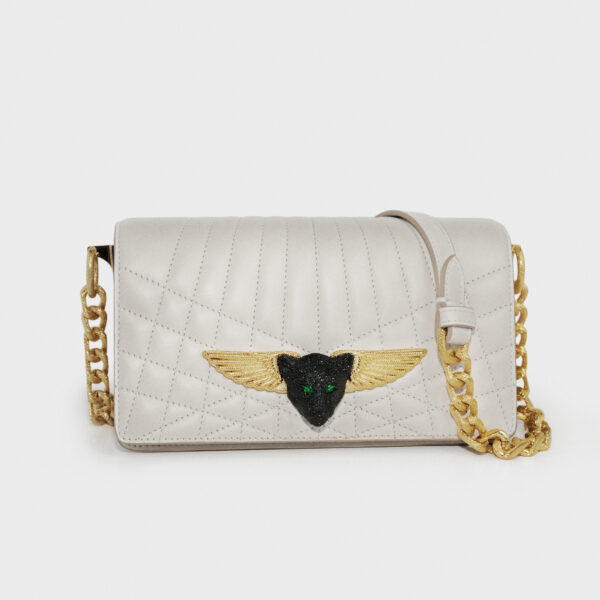Elegant white quilted leather handbag with gold chain strap and winged emblem.