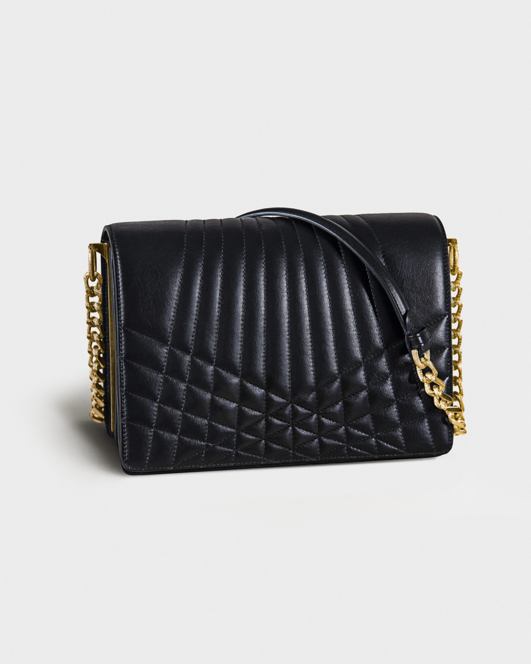 Black quilted leather handbag with gold chain strap.
