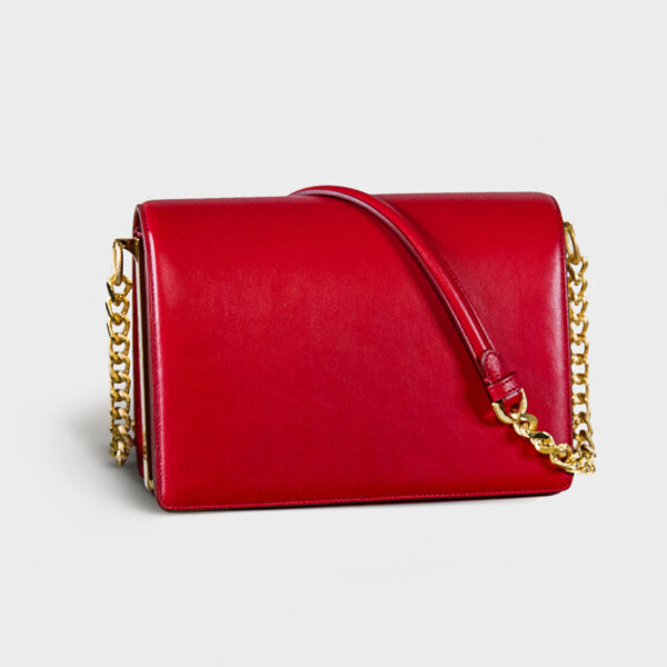 Elegant red leather handbag with gold chain strap.