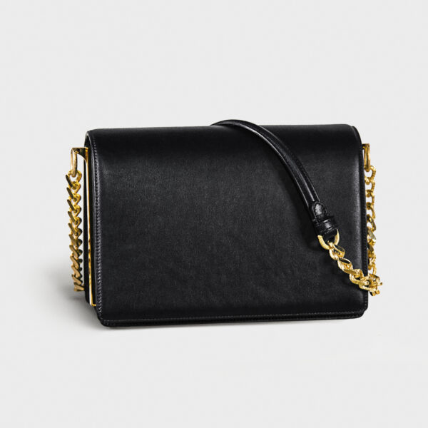 Elegant black leather handbag with gold chain straps.