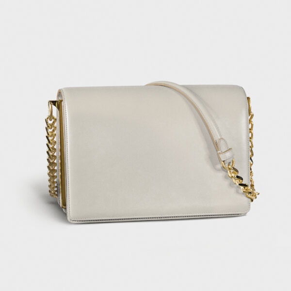 Elegant white handbag with gold chain detail.