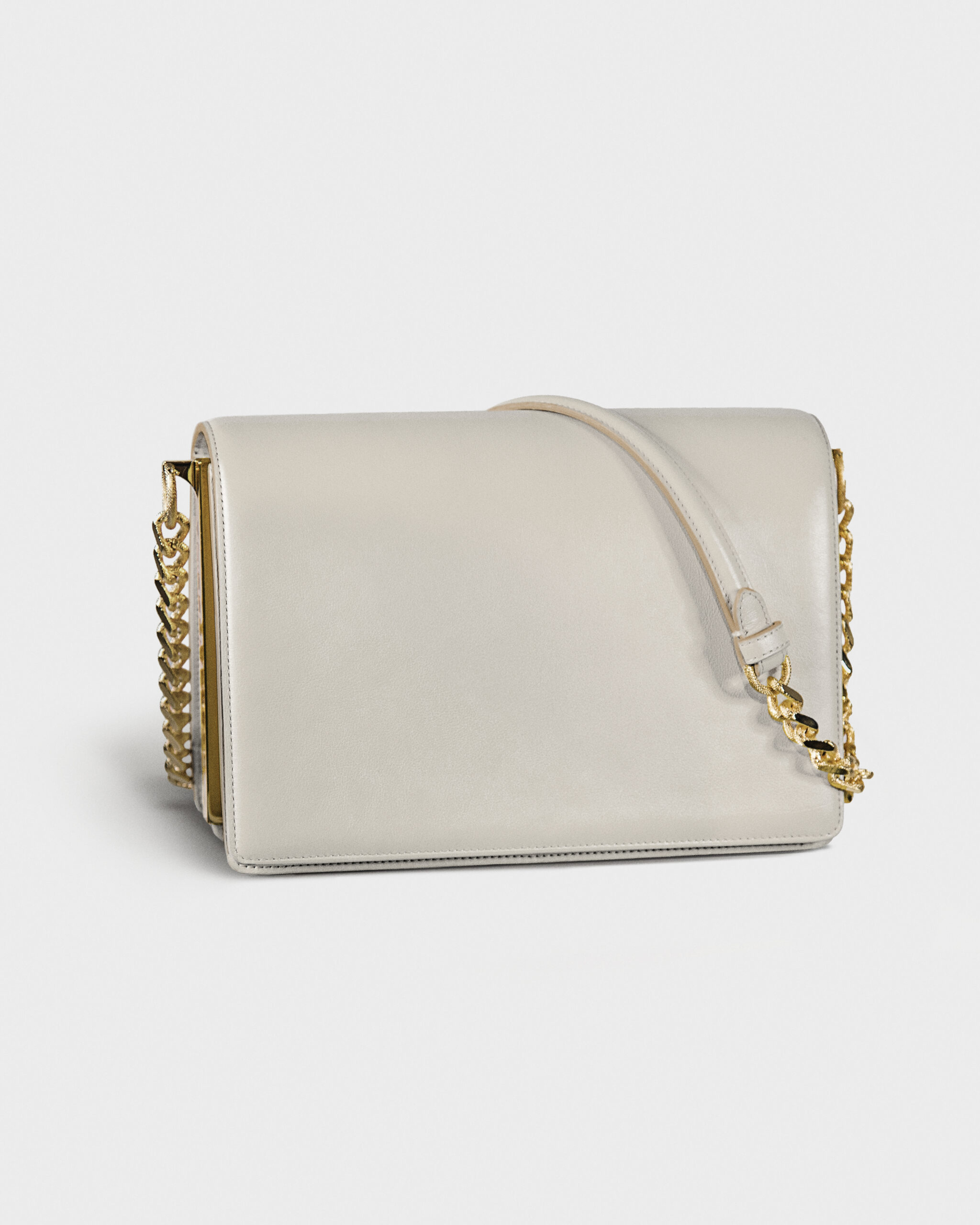 Elegant white handbag with gold chain detail.