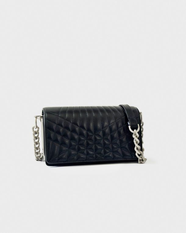 Black quilted handbag with silver chain strap on white background.