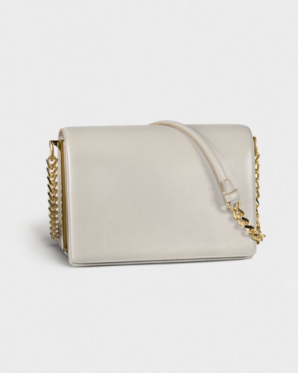 Elegant white handbag with gold chain detail.