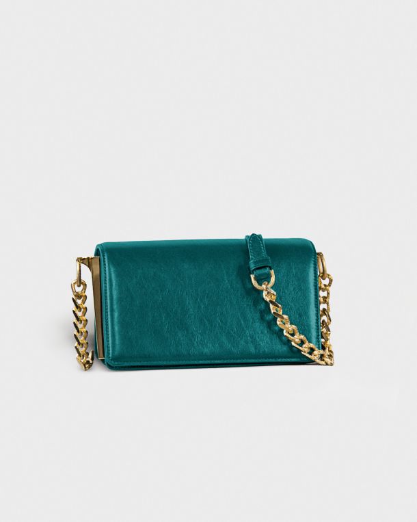 Teal velvet handbag with gold chain strap.