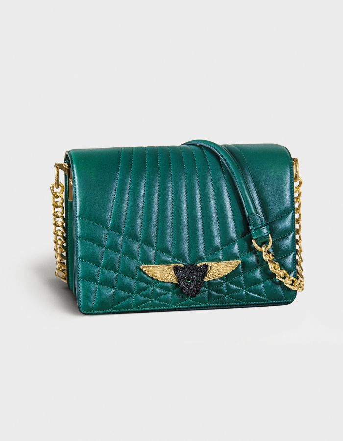 Green quilted leather handbag with gold-tone chain strap and winged emblem.