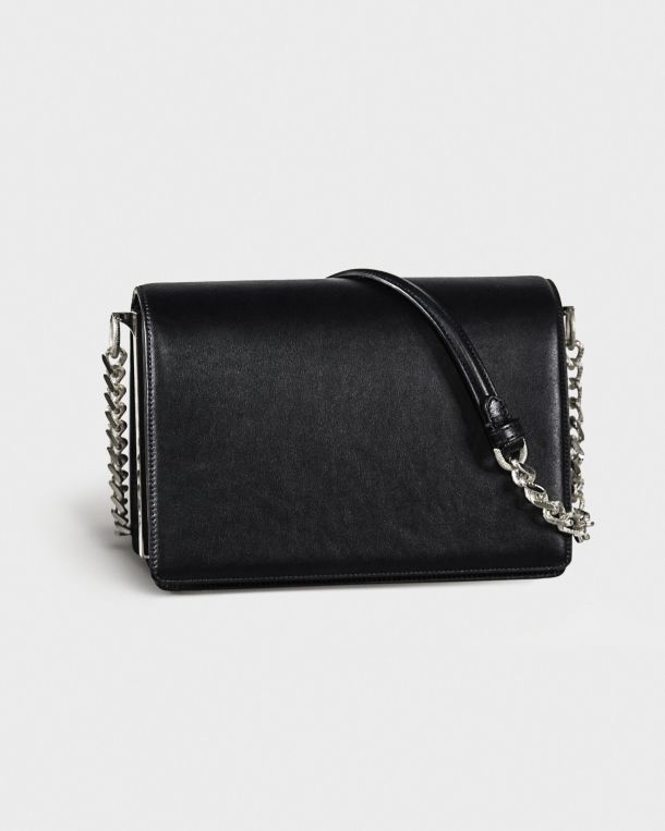 Black leather handbag with silver chain strap on a white background.