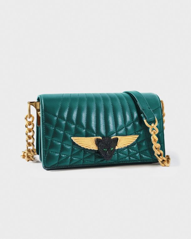 Elegant teal quilted handbag with gold winged emblem and chain strap.