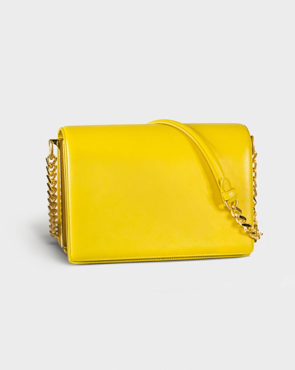 Bright yellow handbag with a gold chain strap.