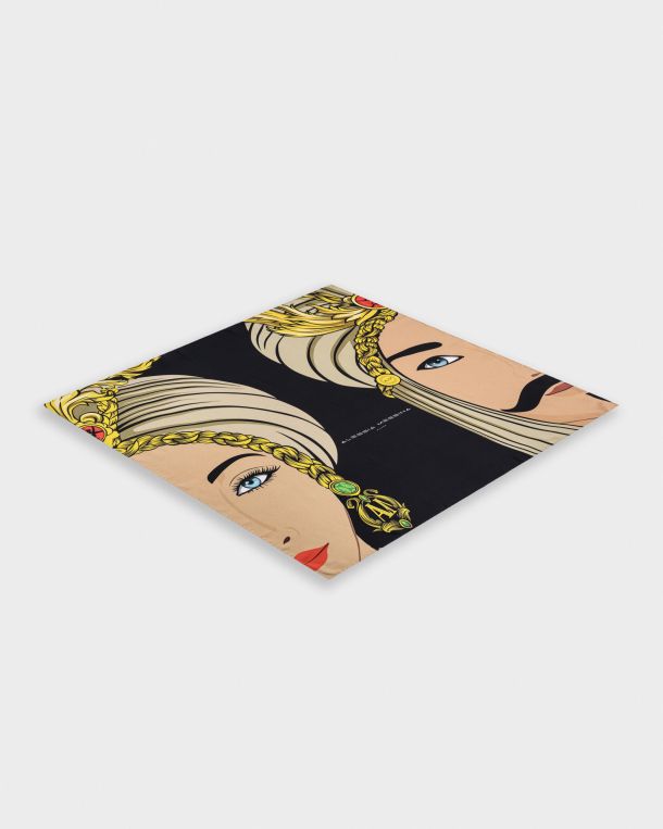 Stylish rug featuring illustrated faces with gold accents on a black background.