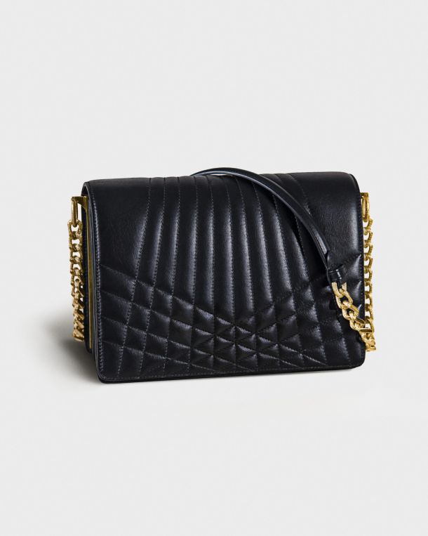 Black quilted leather handbag with gold chain strap.