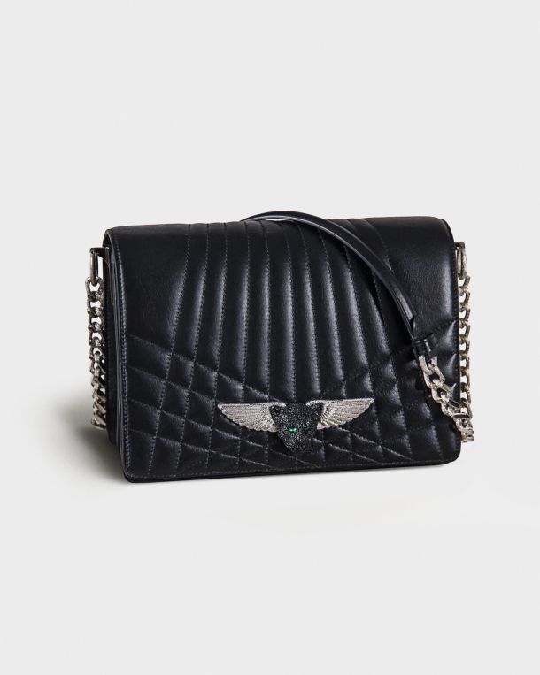 Black quilted leather handbag with silver chain strap and winged emblem.