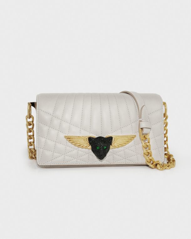 Elegant white quilted leather handbag with gold chain strap and winged emblem.